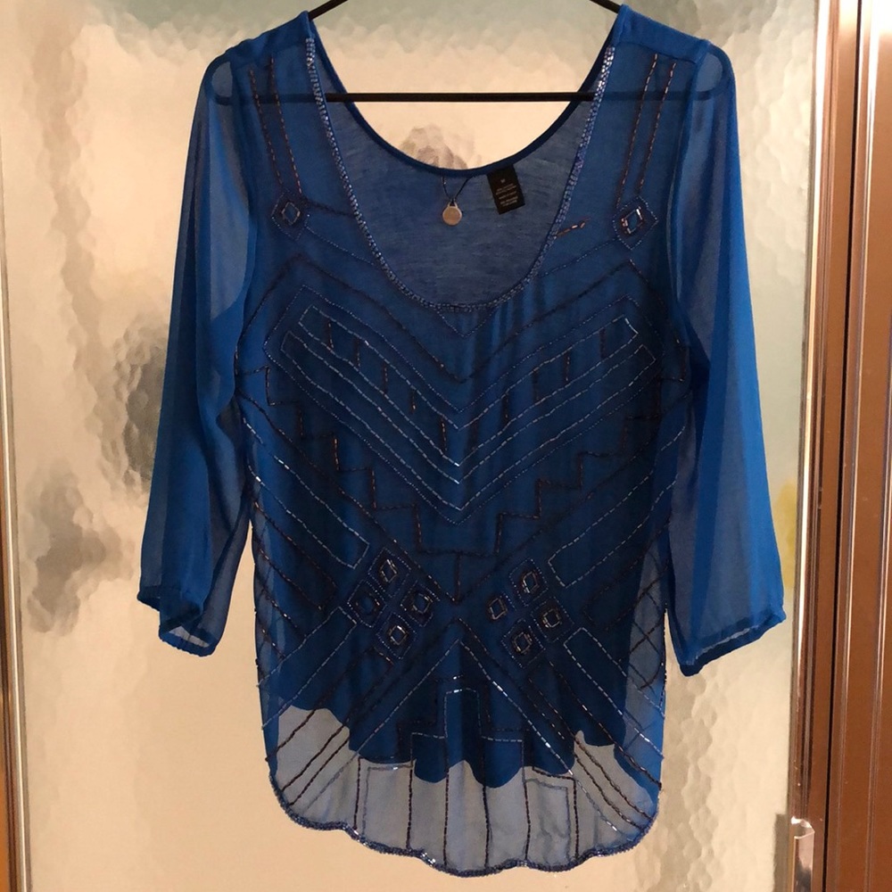 Sheer blue, beaded top.
